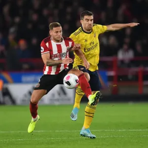 Print of Sokratis vs. Billy Sharp at Bramall Lane