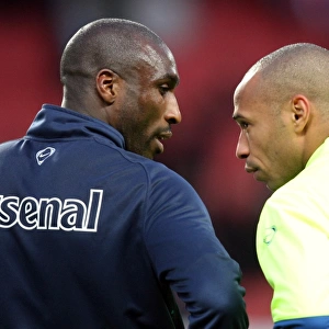 Sol Campbell (Arsenal) chats with Thierry Henry (Barcelona and Ex Arsenal) before the match