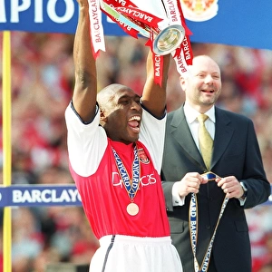 Sol Campbell lifts the F. A. Barclaycard Premiership Trophy