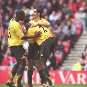 Sol Campbell, Robert Pires and Abu Diaby celebrate the 1st goal