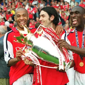 Sol Campbell, Robert Pires and Thierry Henry with the F. A