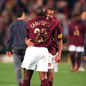 Sol Campbell and Thierry Henry (Arsenal) celebrate at the end of the match