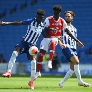 Empty Stadium Showdown: Bukayo Saka vs. Yves Bissouma - A Premier League Battle in Deserted Brighton Stadium