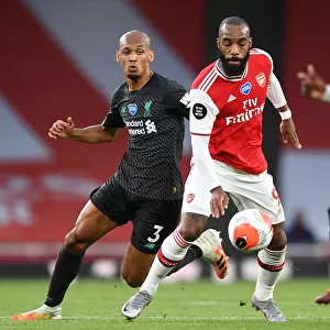 Empty Stadium Showdown: Lacazette vs. Fabinho - Arsenal vs. Liverpool (2019-20): A Battle Unfolds Amidst an Empty Emirates Stadium