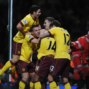 Four Stars: Walcott, Podolski, Ramsey, and Giroud Celebrate Arsenal's Win Against West Ham United (2012-13) Four Stars: Walcott, Podolski, Ramsey, and Giroud Celebrate Arsenal's Win Against West Ham United (2012-13)