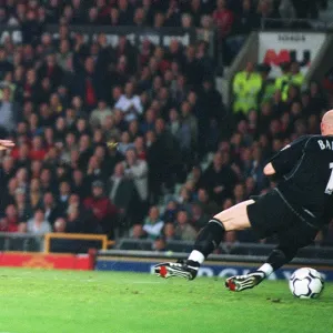 Sylvain Wiltord shoots past Manchester United goalkeeper Fabien Barthez to score the Arsenal goal th