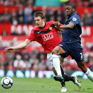Tense Battle: Abou Diaby vs. Michael Carrick - Manchester United's 2-1 Victory over Arsenal in the Premier League