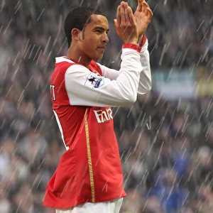 Theo Walcott applauds the Arsenal fans after the match