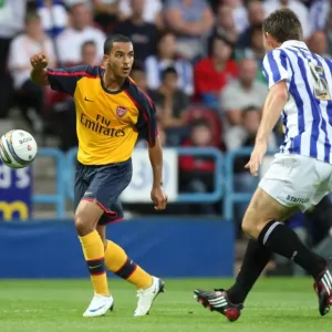 Theo Walcott (Arsenal) Andy Butler (Huddersfield) Theo Walcott (Arsenal) Andy Butler (Huddersfield)