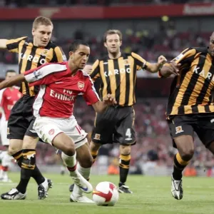 Theo Walcott (Arsenal) Andy Dawson (left) and Kamil Zayatte (Hull) Theo Walcott (Arsenal) Andy Dawson (left) and Kamil Zayatte (Hull)