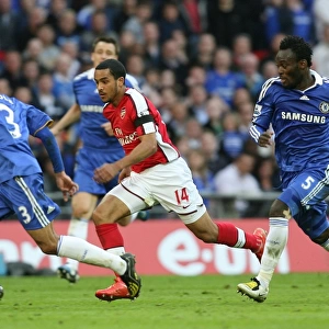 Theo Walcott (Arsenal) Ashley Cole and Michael Essien (Chelsea)