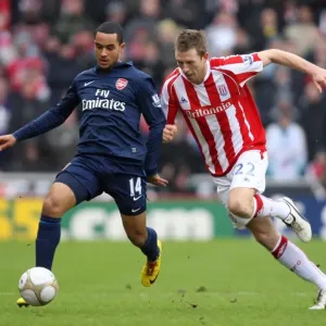 Theo Walcott (Arsenal) Danny Collins (Stoke). Stoke City 3: 1 Arsenal. FA Cup 4th Round Theo Walcott (Arsenal) Danny Collins (Stoke). Stoke City 3: 1 Arsenal. FA Cup 4th Round