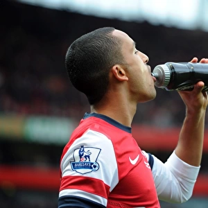 Theo Walcott (Arsenal) with a Lucazade bottle. Arsenal 3: 3 Fulham. Barclays Premier League