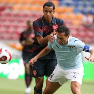 Theo Walcott (Arsenal) Luciano Zauri (Lazio) Theo Walcott (Arsenal) Luciano Zauri (Lazio)