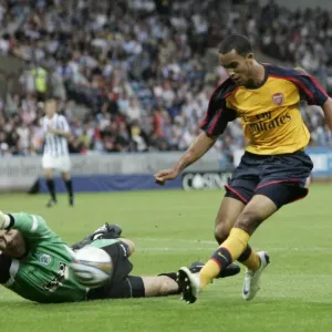 Theo Walcott (Arsenal) Matt Glennon (Huddersfield) Theo Walcott (Arsenal) Matt Glennon (Huddersfield)