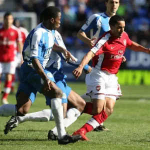 Theo Walcott (Arsenal) Maynor Figueroa and Titus Bramble (Wigan) Theo Walcott (Arsenal) Maynor Figueroa and Titus Bramble (Wigan)