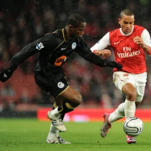 Theo Walcott (Arsenal) Maynor Figueroa (Wigan). Arsenal 2: 0 Wigan Athletic