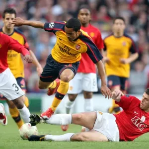 Theo Walcott (Arsenal) Michael Carrick and Patrice Evra (Man Utd) Theo Walcott (Arsenal) Michael Carrick and Patrice Evra (Man Utd)