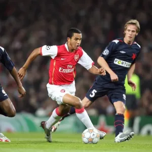 Theo Walcott (Arsenal) Michael Tavares and Michal Svec (Slavia) Theo Walcott (Arsenal) Michael Tavares and Michal Svec (Slavia)