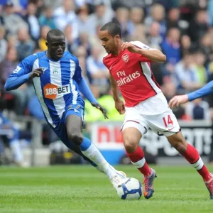 Theo Walcott (Arsenal) Mohamed Diame (Wigan). Wigan Athletic 3: 2 Arsenal