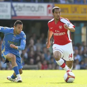 Theo Walcott (Arsenal) Nadir Belhadj (Portsmouth) Theo Walcott (Arsenal) Nadir Belhadj (Portsmouth)