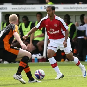Theo Walcott (Arsenal) Neal Bishop (Barnet) Theo Walcott (Arsenal) Neal Bishop (Barnet)