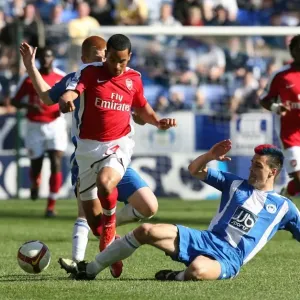 Theo Walcott (Arsenal) Paul Scharner (Wigan) Theo Walcott (Arsenal) Paul Scharner (Wigan)