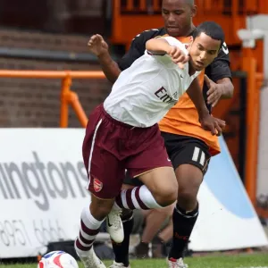 Theo Walcott (Arsenal) Sagi Burton (Barnet) Theo Walcott (Arsenal) Sagi Burton (Barnet)