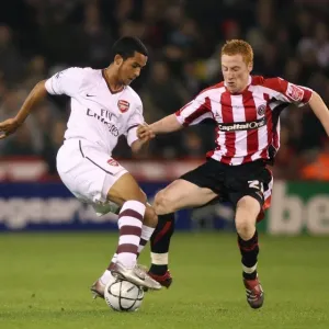 Theo Walcott (Arsenal) Stephen Quinn (Sheff) Theo Walcott (Arsenal) Stephen Quinn (Sheff)