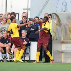 Theo Walcott celebrates scoring the 1st Arsenal goal with Emmanuel Eboue