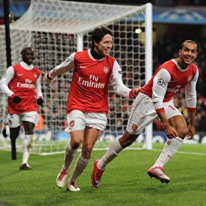 Theo Walcott celebrates scoring the 2nd Arsenal goal with Samir Nasri. Arsenal 3