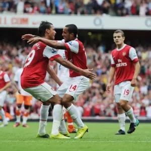 Theo Walcott celebrates scoring the 3rd Arsenal goal with Marouane Chamakh