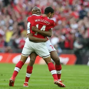 Theo Walcott celebrates scoring the Arsenal goal with Abou Diaby Theo Walcott celebrates scoring the Arsenal goal with Abou Diaby