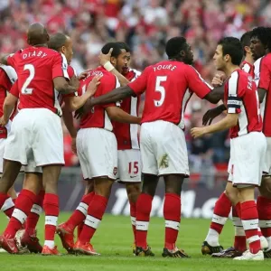 Theo Walcott celebrates scoring the Arsenal goal with Abou Diaby Theo Walcott celebrates scoring the Arsenal goal with Abou Diaby