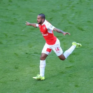 Theo Walcott celebrates scoring Arsenals 1st goal Theo Walcott celebrates scoring Arsenals 1st goal