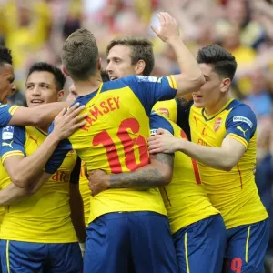 Theo Walcott celebrates scoring Arsenals 1st goal with his team mates. Arsenal 4: 0 Aston Villa Theo Walcott celebrates scoring Arsenals 1st goal with his team mates. Arsenal 4: 0 Aston Villa