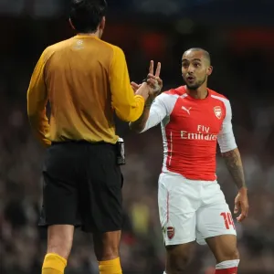 Theo Walcott Confronts Referee Deniz Aytekin during Arsenal vs. AS Monaco UEFA Champions League Match