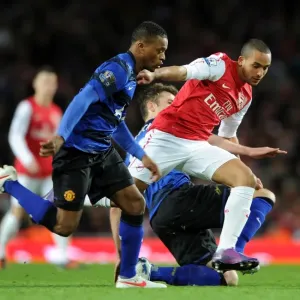 Theo Walcott Dances Past Patrice Evra and Michael Carrick: Arsenal vs Manchester United, Premier League 2011-12 Theo Walcott Dances Past Patrice Evra and Michael Carrick: Arsenal vs Manchester United, Premier League 2011-12