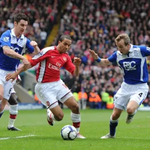 Theo Walcott Faces Off Against Birmingham Duo Liam Ridgewell and Lee Bowyer in Intense Barclays Premier League Clash