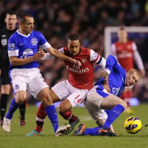 Theo Walcott Faces Off Against Everton's Tony Hibbert and Leon Osman in Premier League Showdown