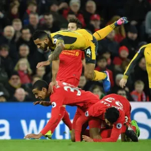 Theo Walcott Faces Off Against Matip and Can in Intense Liverpool vs. Arsenal Premier League Clash Theo Walcott Faces Off Against Matip and Can in Intense Liverpool vs. Arsenal Premier League Clash