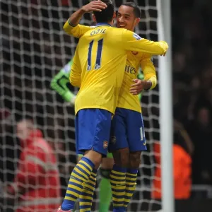 Theo Walcott and Mesut Ozil Celebrate Goals: West Ham United vs. Arsenal (2013-14)