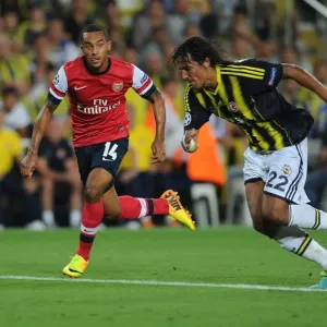 Theo Walcott Outmaneuvers Bruno Alves in Arsenal's UEFA Champions League Clash against Fenerbahce
