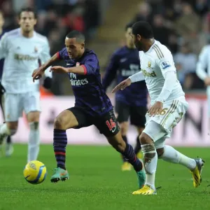 Theo Walcott Outmaneuvers Kemy Agustien in Swansea v Arsenal FA Cup Clash Theo Walcott Outmaneuvers Kemy Agustien in Swansea v Arsenal FA Cup Clash