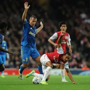 Theo Walcott Outmaneuvers Nicolas N'Koulou and Benoit Cherou as Arsenal Takes on Olympique de Marseille in the UEFA Champions League Theo Walcott Outmaneuvers Nicolas N'Koulou and Benoit Cherou as Arsenal Takes on Olympique de Marseille in the UEFA Champions League