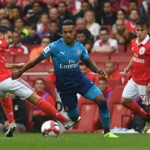 Theo Walcott Outmaneuvers Pizzi in Arsenal's Emirates Cup Clash against SL Benfica Theo Walcott Outmaneuvers Pizzi in Arsenal's Emirates Cup Clash against SL Benfica