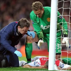 Theo Walcott Receives Treatment from Colin Lewin as Anders Lindegaard Looks On: Arsenal v Manchester United, Premier League 2011-12 Theo Walcott Receives Treatment from Colin Lewin as Anders Lindegaard Looks On: Arsenal v Manchester United, Premier League 2011-12