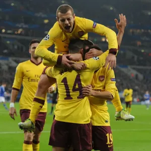 Theo Walcott, Santi Cazorla, and Jack Wilshere: Celebrating Arsenal's First Goal Against Schalke 04 in the 2012-13 UEFA Champions League Theo Walcott, Santi Cazorla, and Jack Wilshere: Celebrating Arsenal's First Goal Against Schalke 04 in the 2012-13 UEFA Champions League