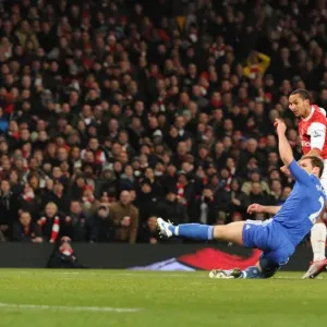 Theo Walcott scores Arsenals 3rd goal under pressure from Branislav Ivanovic Theo Walcott scores Arsenals 3rd goal under pressure from Branislav Ivanovic