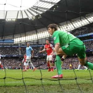 Theo Walcott Scores Against Manchester City: Yaya Toure, Martin Demichelis, and Costel Pantilimon Theo Walcott Scores Against Manchester City: Yaya Toure, Martin Demichelis, and Costel Pantilimon